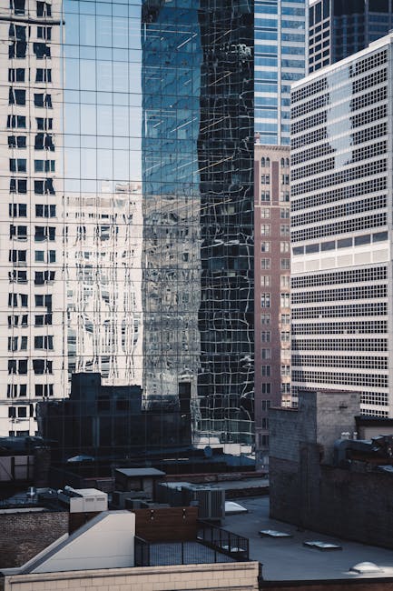 Reflective skyscrapers in downtown Chicago, showcasing modern architecture and urban design.